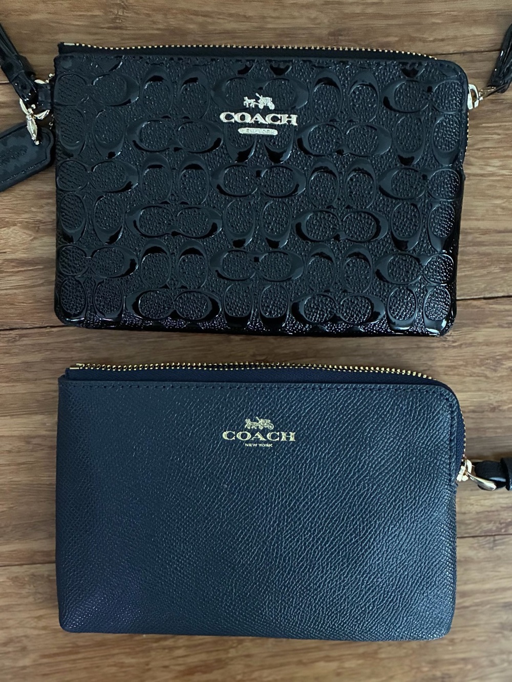Two Coach Women's Wristlets. Black patent leather and pebbled navy blue